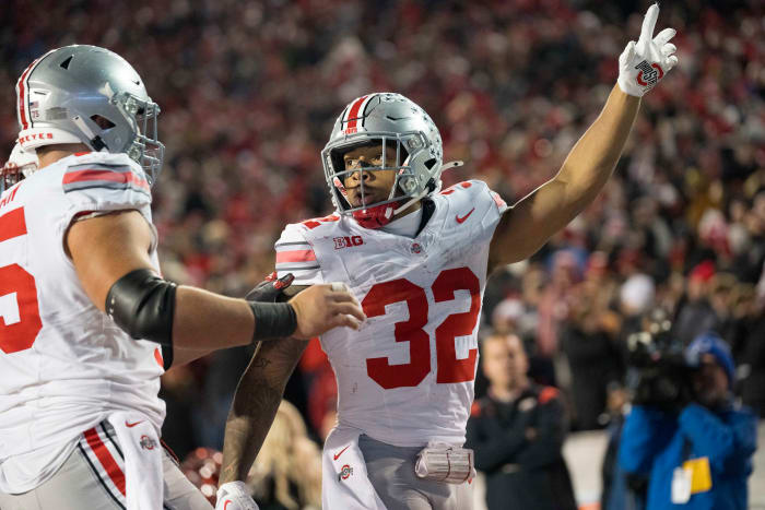 Oct 28, 2023; Madison, Wisconsin, USA; Ohio State Buckeyes running back TreVeyon Henderson (32) celebrates after scoring a touchdown during the fourth quarter against the Wisconsin Badgers at Camp Randall Stadium.